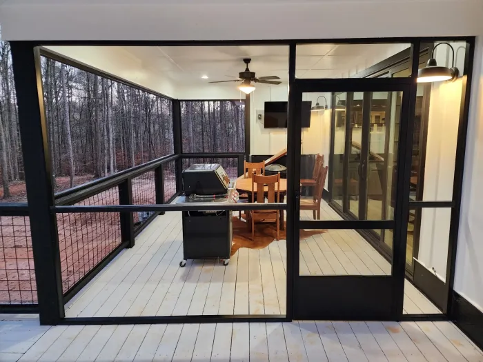 Screen porch with a natural timber finish, built by Screen America in North Georgia