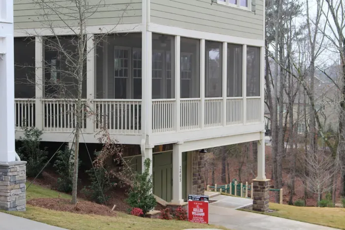 Second-level screen porch with white framing, built by Screen America in North Georgia