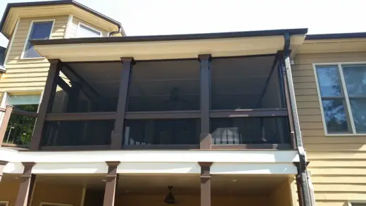 Two-story screen porch with brown trim accents — built by Screen America in North Georgia